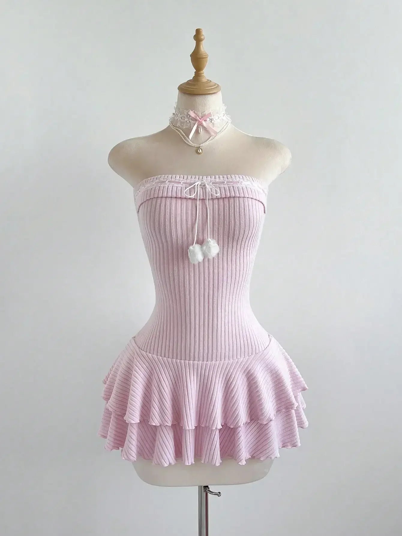 Knit ruffle hem pom pom mini dress